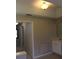 Hallway leading to additional rooms with neutral color paint and carpeted flooring at 31104 Fairvista Dr, Tavares, FL 32778