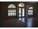 Open living area with tile floors and arched windows offers lots of natural light at 31104 Fairvista Dr, Tavares, FL 32778