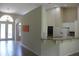 Open living area showcasing seamless flow to the kitchen and access to outdoor spaces at 31104 Fairvista Dr, Tavares, FL 32778