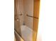 Shower with glass doors, safety bar and tile walls creating a functional and clean space at 31104 Fairvista Dr, Tavares, FL 32778
