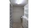 This walk-in closet has multiple shelves and plenty of room for storing clothes and accessories at 31104 Fairvista Dr, Tavares, FL 32778