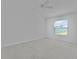 Bright, open bedroom with carpet flooring, a ceiling fan, and a large window at 3283 Dawn Pl, The Villages, FL 32163