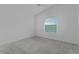 Bright bedroom features a ceiling fan and a window letting in natural light at 3283 Dawn Pl, The Villages, FL 32163