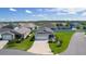 Charming home featuring a two-car garage and well-maintained lawn with a sidewalk at 3283 Dawn Pl, The Villages, FL 32163