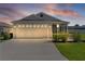 Charming single-story home with well-manicured lawn, screened porch and two-car garage at 3283 Dawn Pl, The Villages, FL 32163