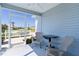 Relaxing screened-in patio with outdoor seating, offering a pleasant space to enjoy the fresh air and neighborhood views at 3283 Dawn Pl, The Villages, FL 32163