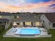 Aerial view showcasing the backyard oasis with a pool, spa, and outdoor entertaining space at 3304 Canna Lily Pl, Clermont, FL 34711