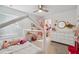 A whimsical bedroom with a canopy bed, playful decor, and bright natural light for a cheerful space at 3304 Canna Lily Pl, Clermont, FL 34711