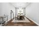Formal dining room showcasing a modern chandelier, elegant fireplace and mantel, and stylish furniture at 3304 Canna Lily Pl, Clermont, FL 34711