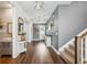 Welcoming entryway with elegant decor and staircase leading to the upper level at 3304 Canna Lily Pl, Clermont, FL 34711