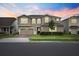 Charming two-story home boasts a well-manicured lawn and a welcoming front entrance at 3304 Canna Lily Pl, Clermont, FL 34711