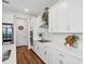 Bright and airy kitchen featuring white cabinetry, modern appliances, and stylish decor at 3304 Canna Lily Pl, Clermont, FL 34711