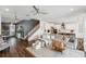 Bright open-concept living space with a modern kitchen and access to the upstairs at 3304 Canna Lily Pl, Clermont, FL 34711