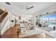 Spacious living room flowing into the kitchen and outdoor living with stunning lake views at 3304 Canna Lily Pl, Clermont, FL 34711