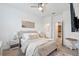 Serene primary bedroom features a comfortable bed, soft lighting, and ensuite bathroom for ultimate relaxation at 3304 Canna Lily Pl, Clermont, FL 34711