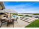 An inviting backyard oasis with a pool, spa, and picturesque water view for relaxation and outdoor enjoyment at 3304 Canna Lily Pl, Clermont, FL 34711