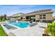 Relaxing backyard features a beautiful pool, patio, and outdoor kitchen, ideal for enjoying the outdoors at 3304 Canna Lily Pl, Clermont, FL 34711
