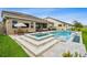 A stunning backyard featuring a pool, spa, and outdoor seating, perfect for entertaining and relaxation at 3304 Canna Lily Pl, Clermont, FL 34711