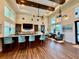 This spacious clubhouse boasts tall ceilings, a bar, and elegant seating at 3607 Umbrella Tree Ln, Oxford, FL 34484