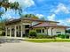 Stunning building showcasing modern architecture, a metal roof, and landscaped surroundings at 3607 Umbrella Tree Ln, Oxford, FL 34484