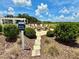Community sunset fire pit with seating area provides a cozy space for residents to gather and socialize at 3607 Umbrella Tree Ln, Oxford, FL 34484