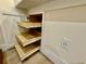 Kitchen featuring pull-out shelving in the cabinets and a nearby electrical outlet at 3607 Umbrella Tree Ln, Oxford, FL 34484