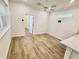 Living room with light walls, flooring, and entrance to other rooms in this open concept at 3607 Umbrella Tree Ln, Oxford, FL 34484