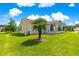 Well-kept backyard featuring a lush lawn and mature landscaping, perfect for relaxing outdoors at 362 Arbella Loop, The Villages, FL 32162