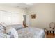 Bright bedroom featuring hardwood floors, two twin beds, closet and ceiling fan at 362 Arbella Loop, The Villages, FL 32162