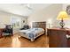 A bedroom with a ceiling fan and wood floors at 362 Arbella Loop, The Villages, FL 32162