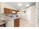 A kitchen with granite countertops, stainless steel appliances, and a breakfast bar at 362 Arbella Loop, The Villages, FL 32162