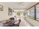 Bright sunroom featuring tile floors, ceiling fans, and large windows offering lots of natural light at 362 Arbella Loop, The Villages, FL 32162