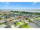 Aerial view of a beautiful home in a serene neighborhood by the lake, offering picturesque views at 3759 Orient Ave, The Villages, FL 32163