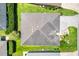 An aerial view of a well-maintained house, mature landscaping, and backyard at 3759 Orient Ave, The Villages, FL 32163