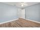 Bedroom with a ceiling fan, wood floors, and white trim at 3759 Orient Ave, The Villages, FL 32163