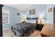 Bedroom with a window, a large bed, and a chest of drawers at 3759 Orient Ave, The Villages, FL 32163