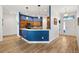 Stylish kitchen with a breakfast bar, wood cabinets and modern stainless steel appliances at 3759 Orient Ave, The Villages, FL 32163