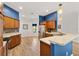 A well-lit open concept kitchen area with modern appliances and a breakfast bar at 3759 Orient Ave, The Villages, FL 32163