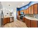 A well-equipped kitchen with ample counter space, wood cabinets, and modern appliances at 3759 Orient Ave, The Villages, FL 32163