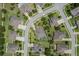 Overhead view shows the screened-in pool and lush landscaping of the backyard, plus neighborhood streets at 4018 Chandler Estates Dr, Apopka, FL 32712