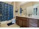 Clean bathroom featuring a vanity with ample storage, shower/tub combo, and neutral color scheme at 4018 Chandler Estates Dr, Apopka, FL 32712