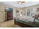 Bedroom with a large bed, TV, ceiling fan, and view of the outdoors through sliding glass doors at 4018 Chandler Estates Dr, Apopka, FL 32712
