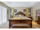 Bedroom with dark wood furniture and a yellow and grey color scheme and decorative curtains at 4018 Chandler Estates Dr, Apopka, FL 32712