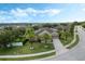 Well-maintained home features mature palm trees, lush lawn and long driveway to the attached two-car garage at 4018 Chandler Estates Dr, Apopka, FL 32712