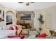 Comfortable living room with fireplace, stone accent wall, and neutral-toned furnishings at 4018 Chandler Estates Dr, Apopka, FL 32712