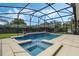 Relaxing screened-in pool and spa area with ample patio space for entertaining at 4018 Chandler Estates Dr, Apopka, FL 32712