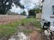 Spacious backyard with wooden fence needing some TLC and landscaping at 402 E Maple St, Winter Garden, FL 34787