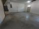 Spacious basement with painted block walls ready for customization at 402 E Maple St, Winter Garden, FL 34787
