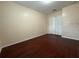 This bedroom features wood-look floors and a double-door closet at 402 E Maple St, Winter Garden, FL 34787