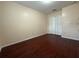 This bedroom features wood-look floors and a double-door closet at 402 E Maple St, Winter Garden, FL 34787